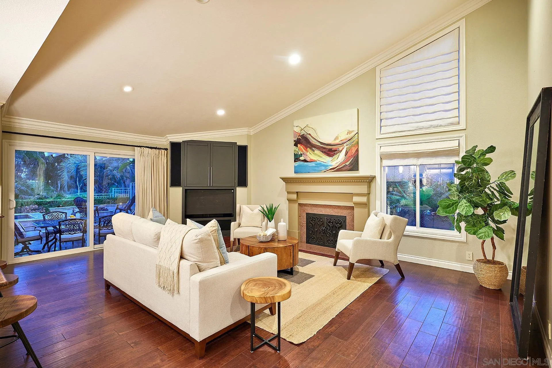 2027 Alga Road Carlsbad, CA 92009 - Photo 24 of 72 a living room with furniture fireplace and wooden floor