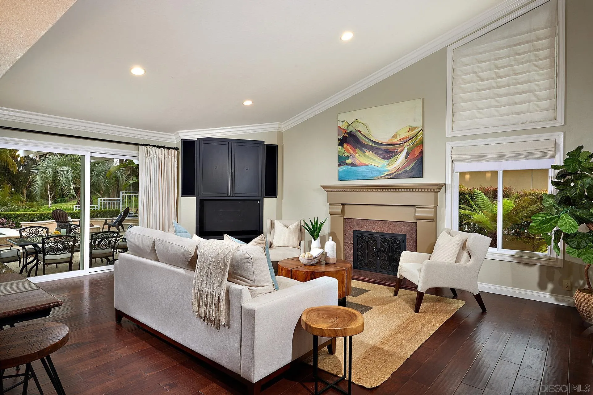 2027 Alga Road Carlsbad, CA 92009 - Photo 25 of 72 a living room with furniture fireplace and a large window