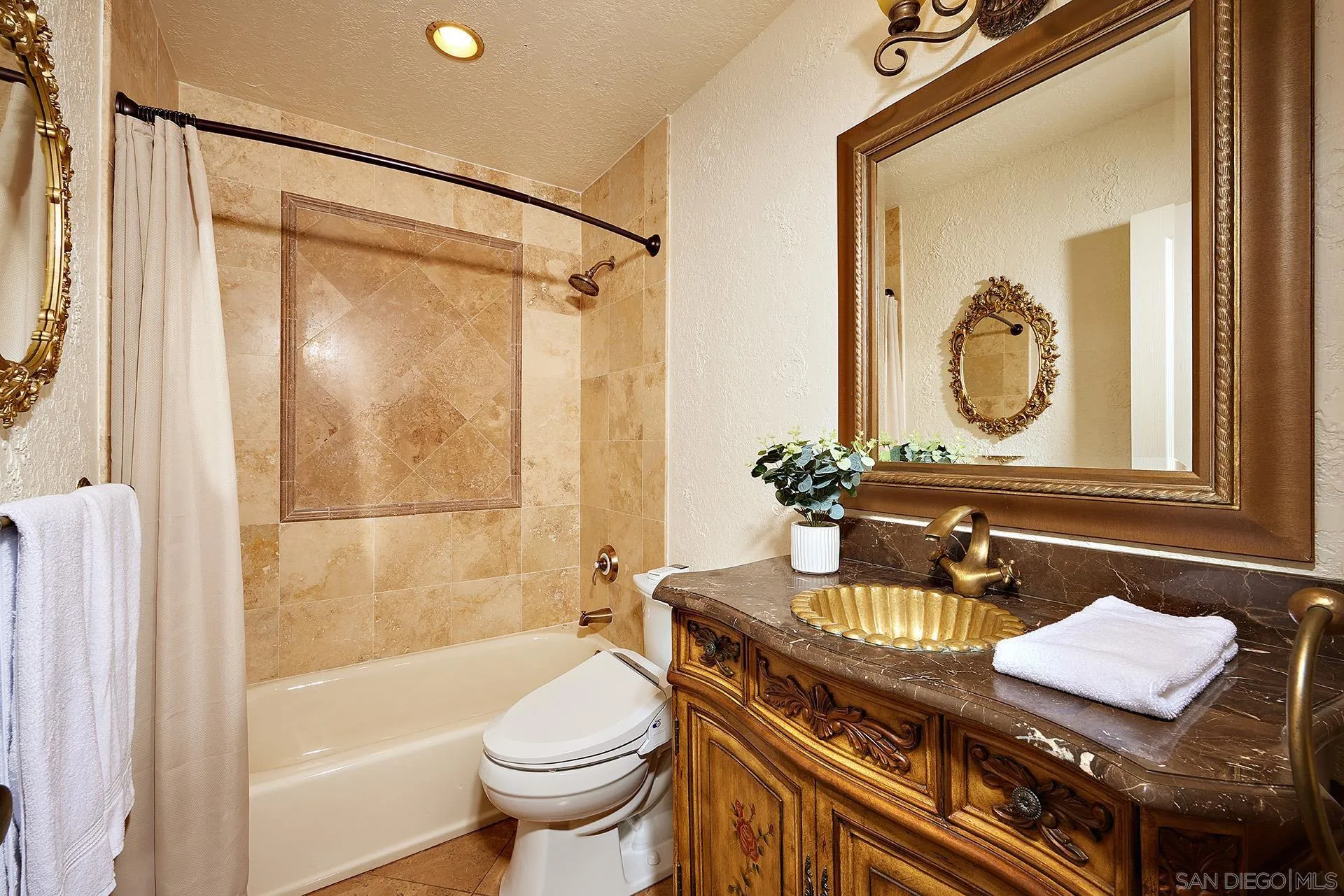 2027 Alga Road Carlsbad, CA 92009 - Photo 39 of 72 a bathroom with a granite countertop sink toilet and shower