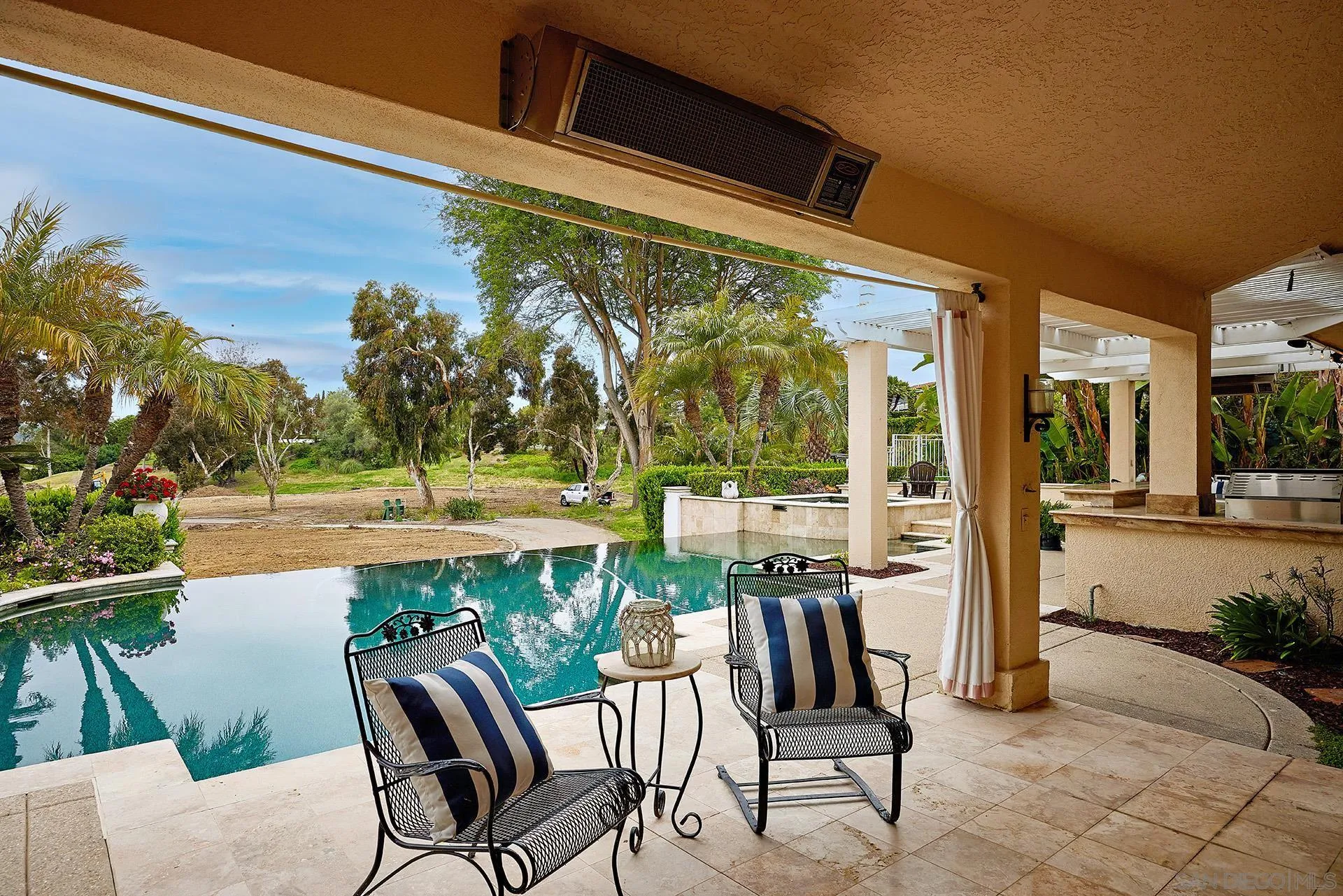 2027 Alga Road Carlsbad, CA 92009 - Photo 47 of 72 a porch with a table and chairs