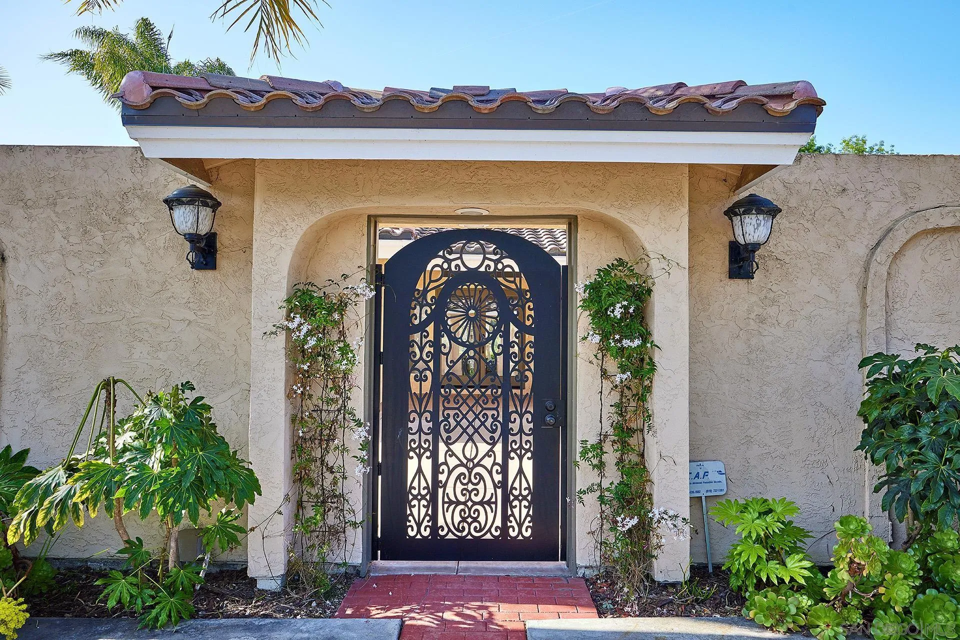 2027 Alga Road Carlsbad, CA 92009 - Photo 54 of 72 a front view of a house with a yard