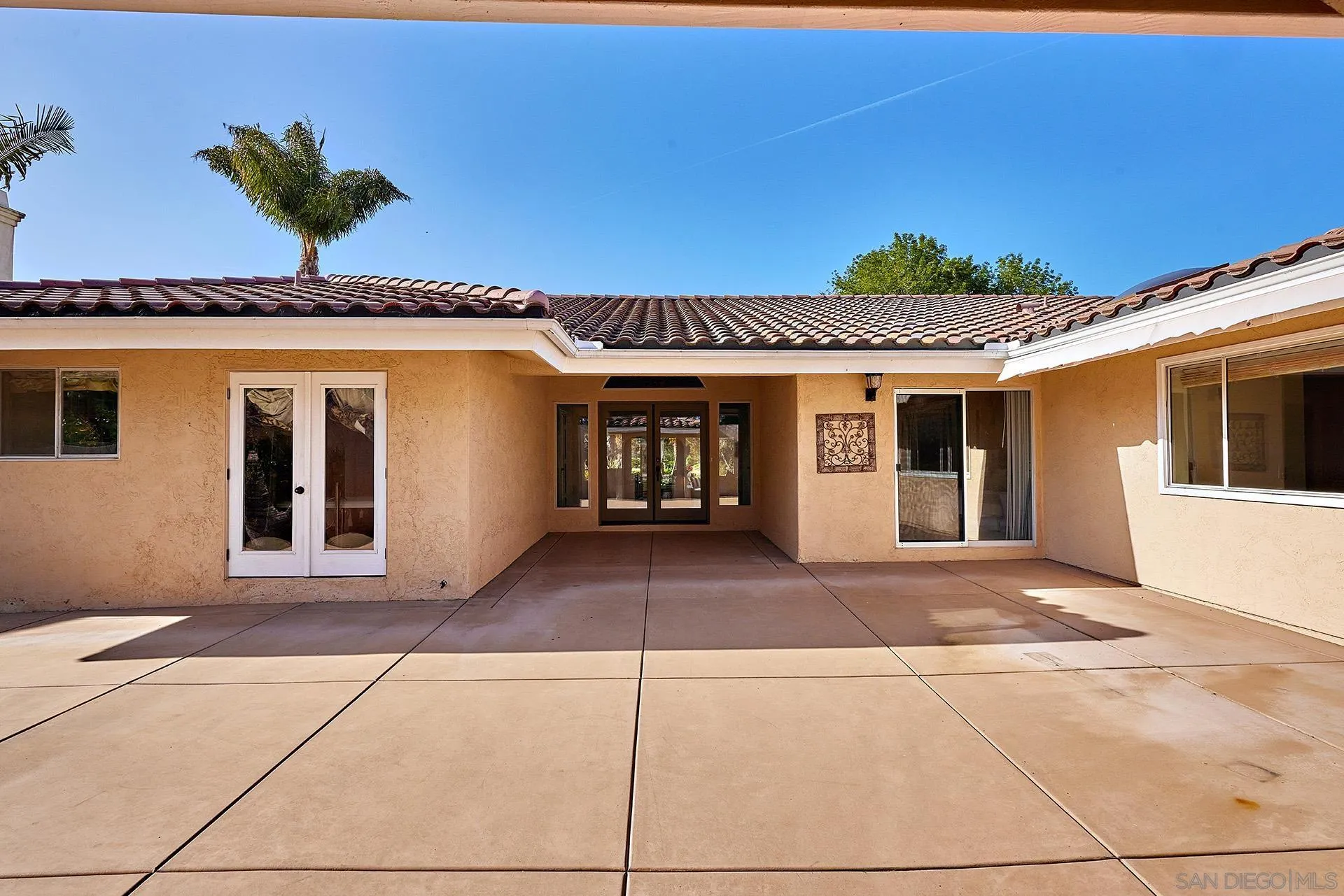 2027 Alga Road Carlsbad, CA 92009 - Photo 57 of 72 a front view of a house with a garage