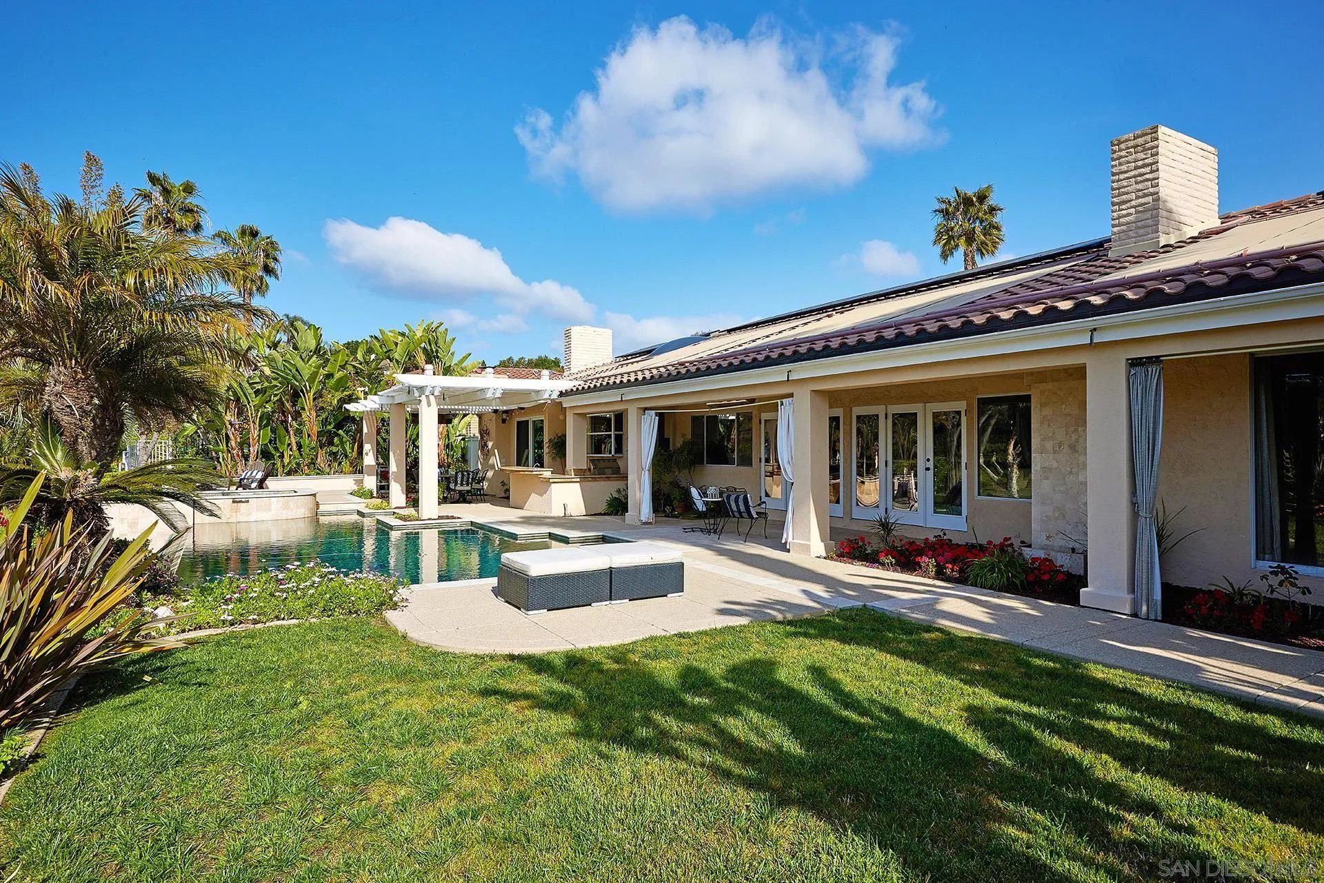 2027 Alga Road Carlsbad, CA 92009 - Photo 59 of 72 a view of a house with backyard sitting area and garden