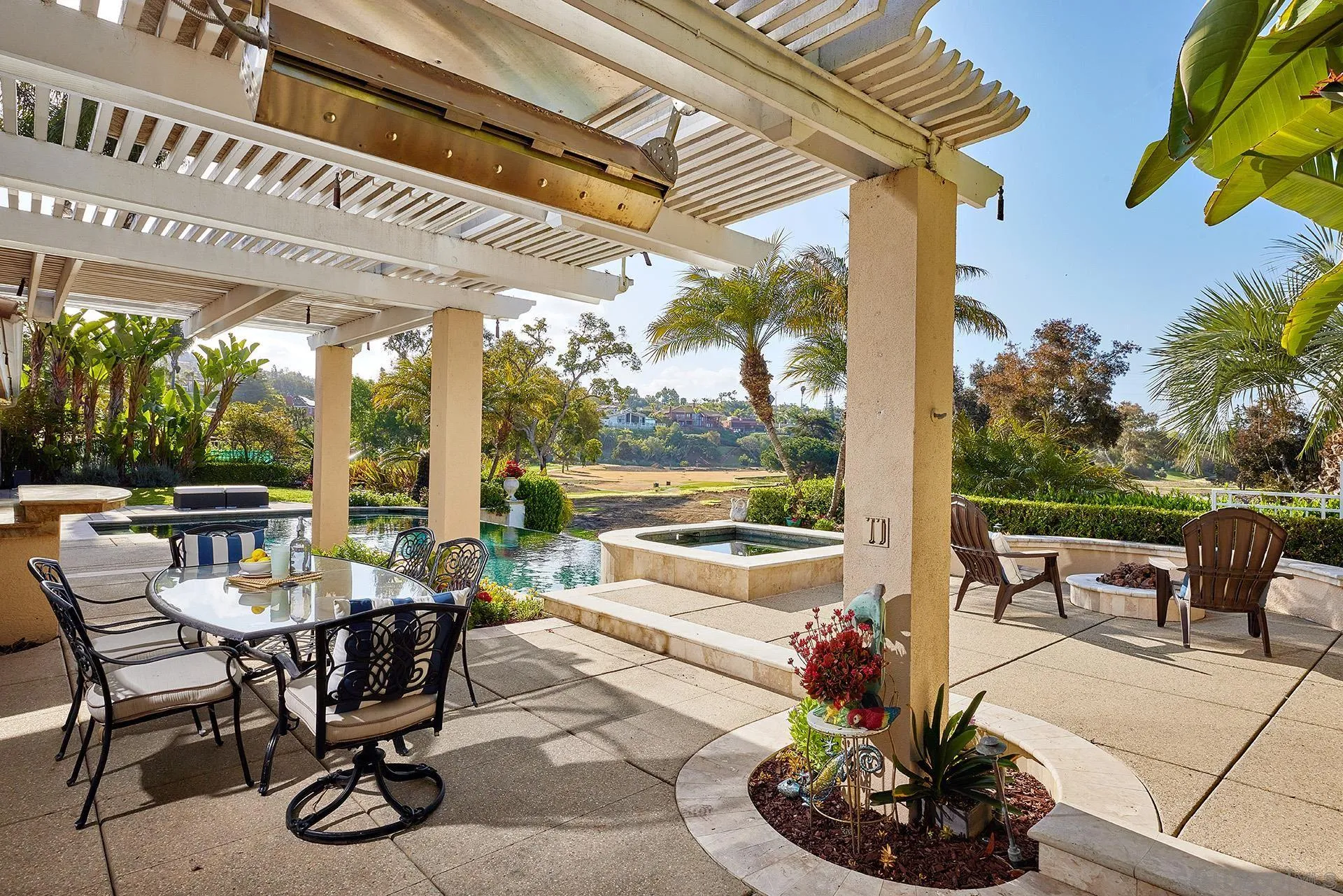 2027 Alga Road Carlsbad, CA 92009 - Photo 60 of 72 a view of a patio with a dining table and chairs with a patio