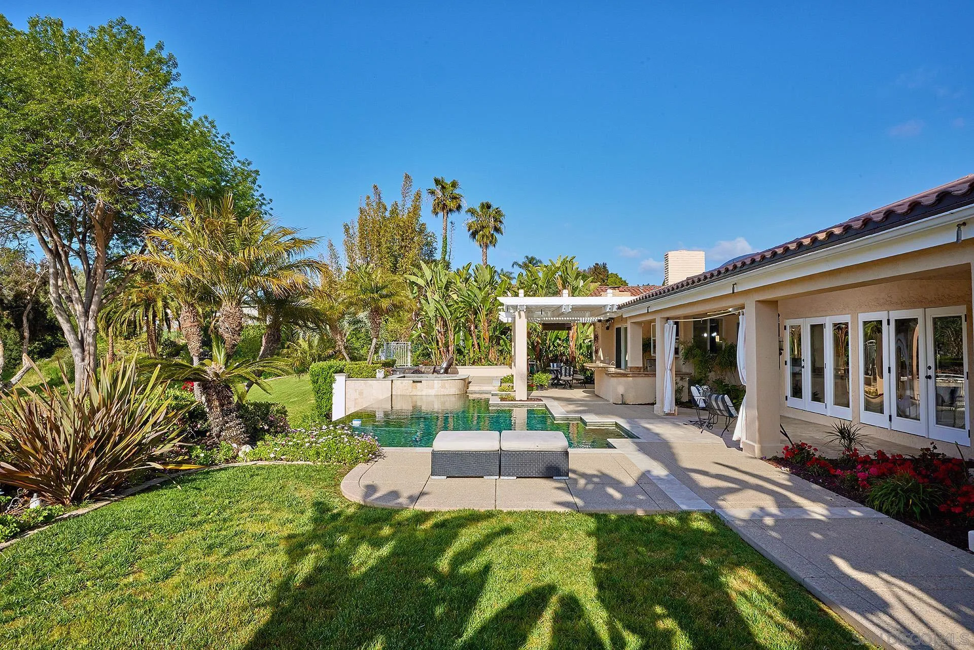 2027 Alga Road Carlsbad, CA 92009 - Photo 62 of 72 a front view of a house with a yard