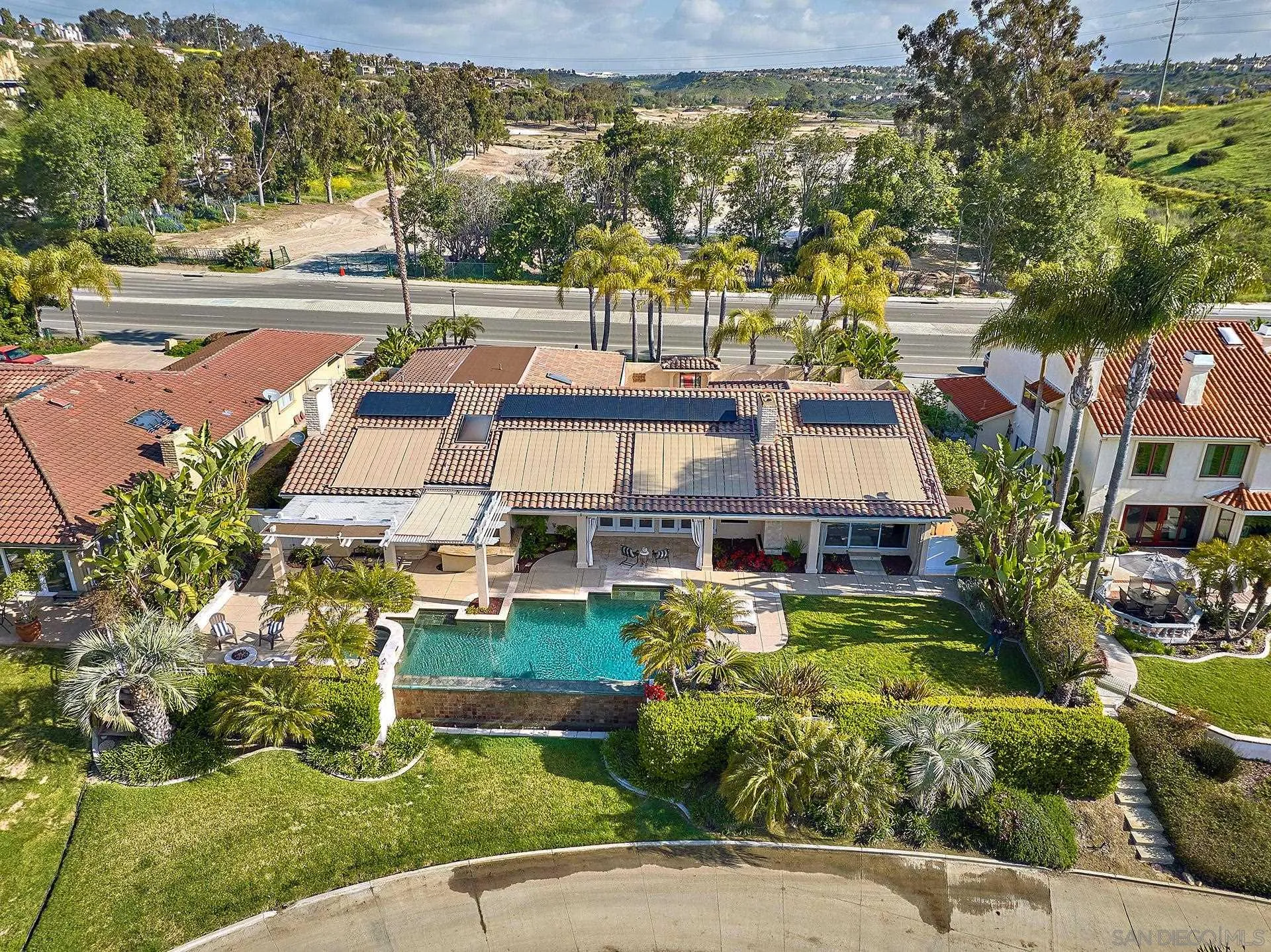 2027 Alga Road Carlsbad, CA 92009 - Photo 64 of 72 a aerial view of a house with swimming pool garden and patio