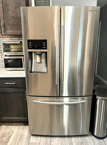 a view of a refrigerator in kitchen and a refrigerator