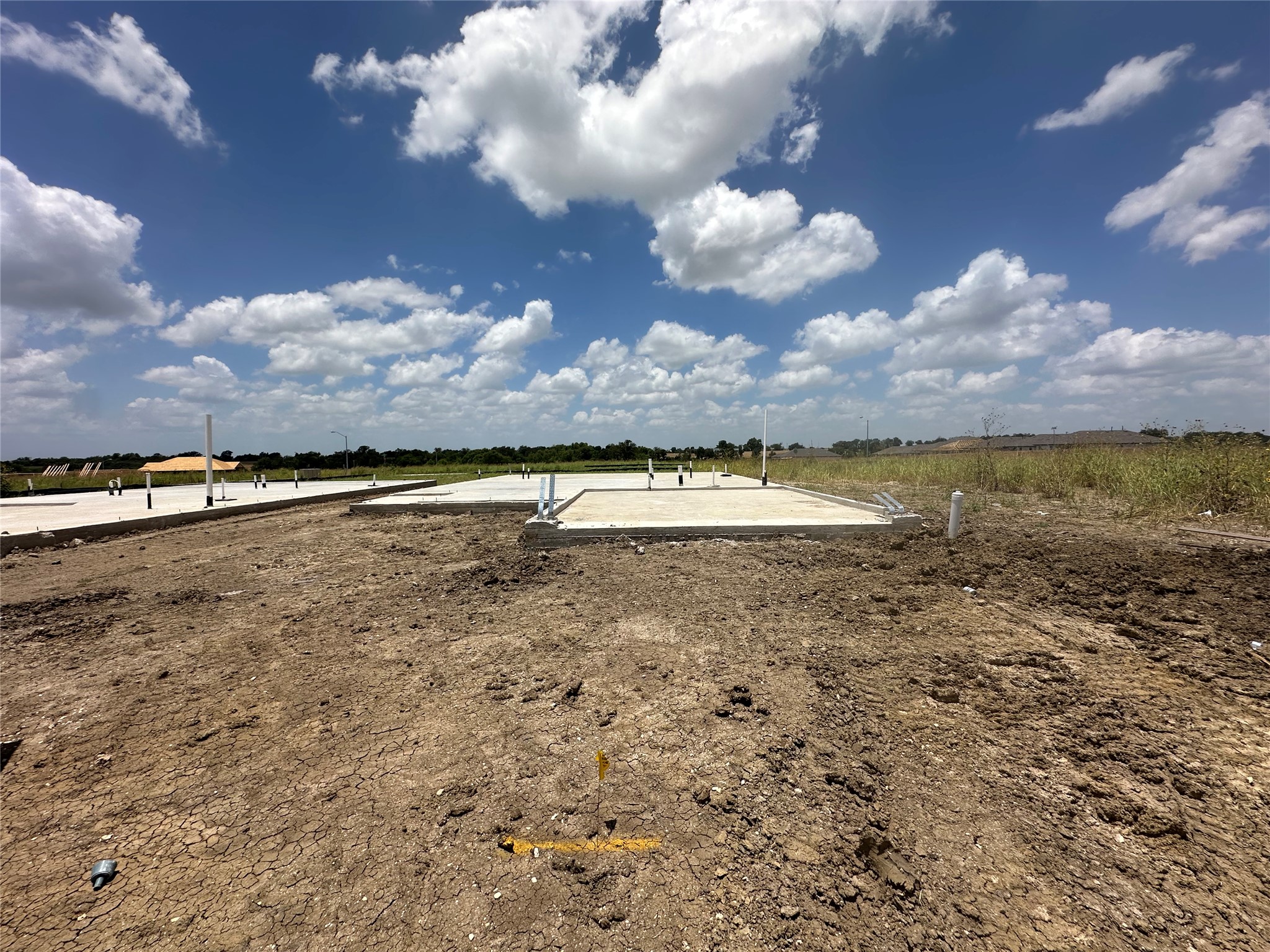 13808 Ryan Range Lane Elgin, TX 78621 - Photo 1 of 12 A newly poured foundation signals the beginning of your dream home construction.
