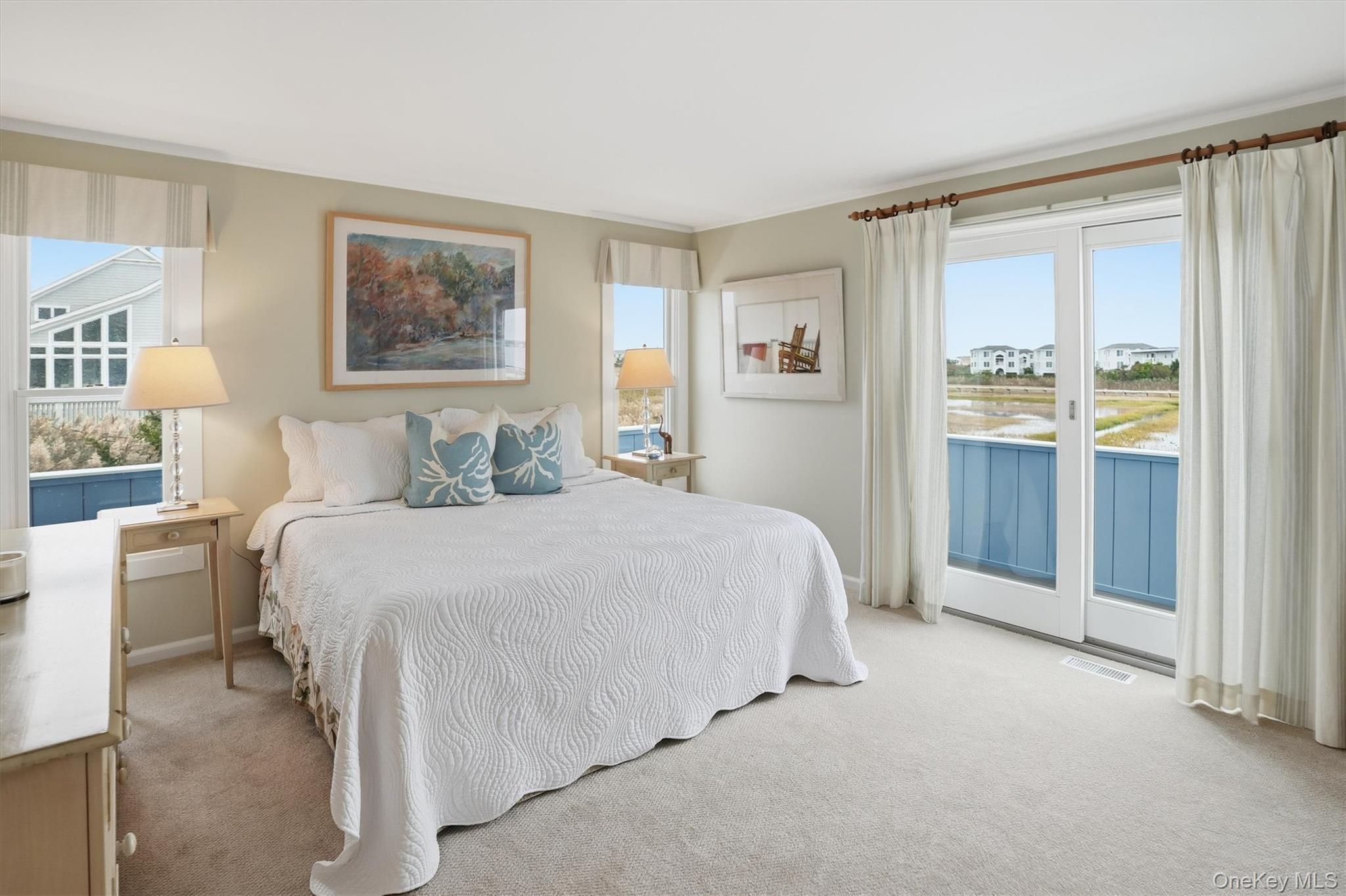 556 Dune Road Westhampton, NY 11978 - Photo 13 of 20 a bedroom with a bed and a window