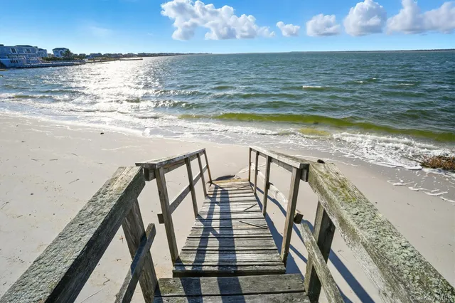 a view of a balcony with an ocean