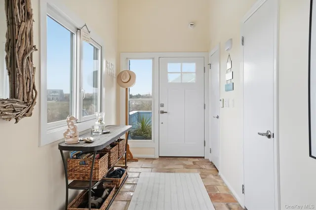 a view of a livingroom with furniture and window