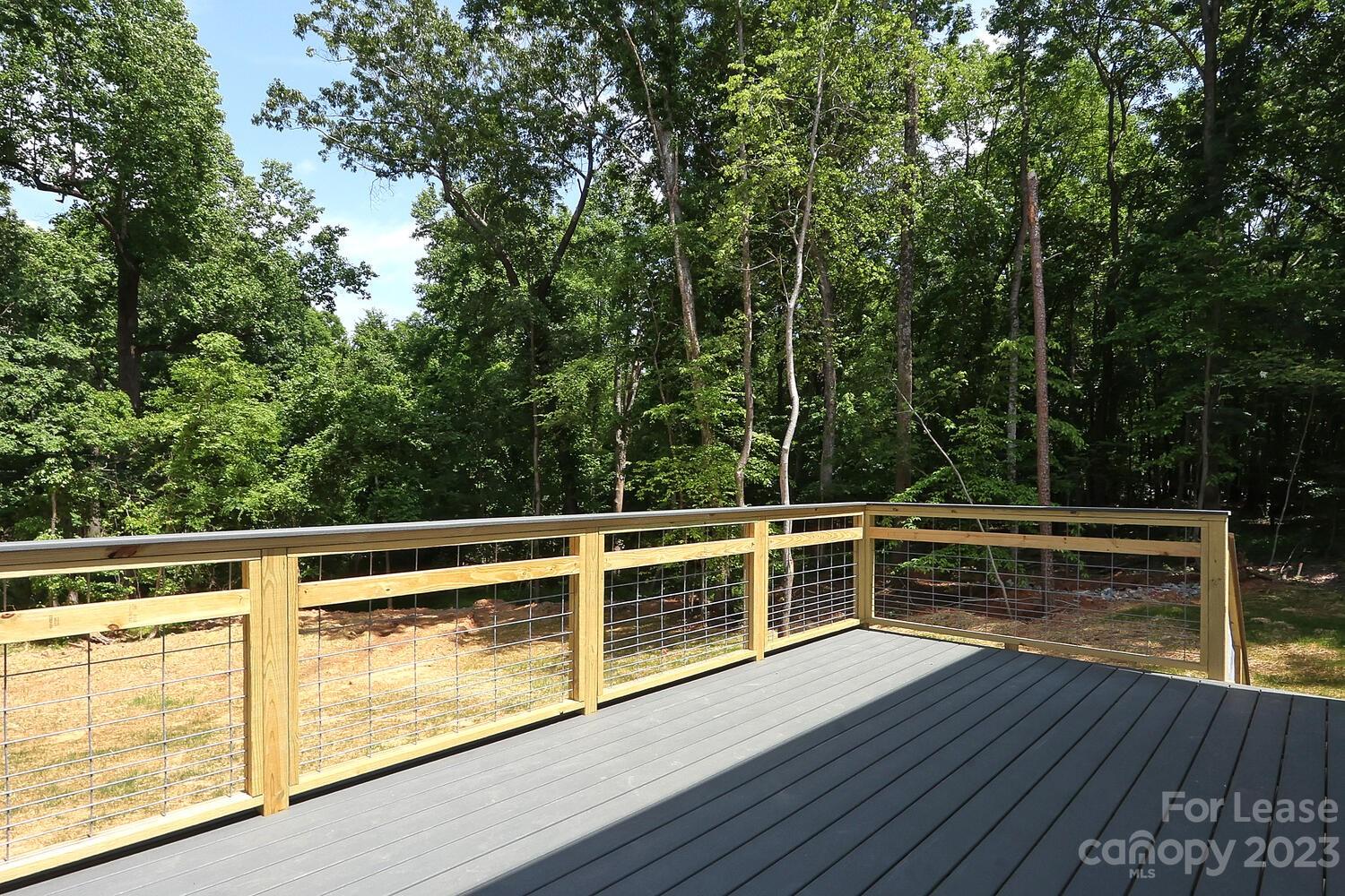 8710 Island Point Road Sherrills Ford, NC 28673 - Photo 15 of 48 a view of a roof deck with wooden floor and fence