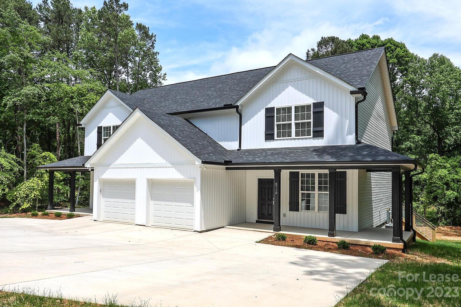 8710 Island Point Road Sherrills Ford, NC 28673 - Photo 2 of 48 a front view of a house with a yard