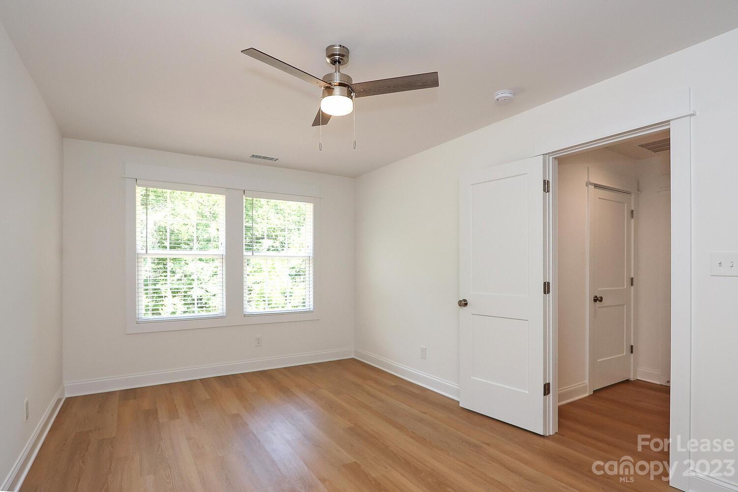 8710 Island Point Road Sherrills Ford, NC 28673 - Photo 30 of 48 a view of an empty room with wooden floor and a window