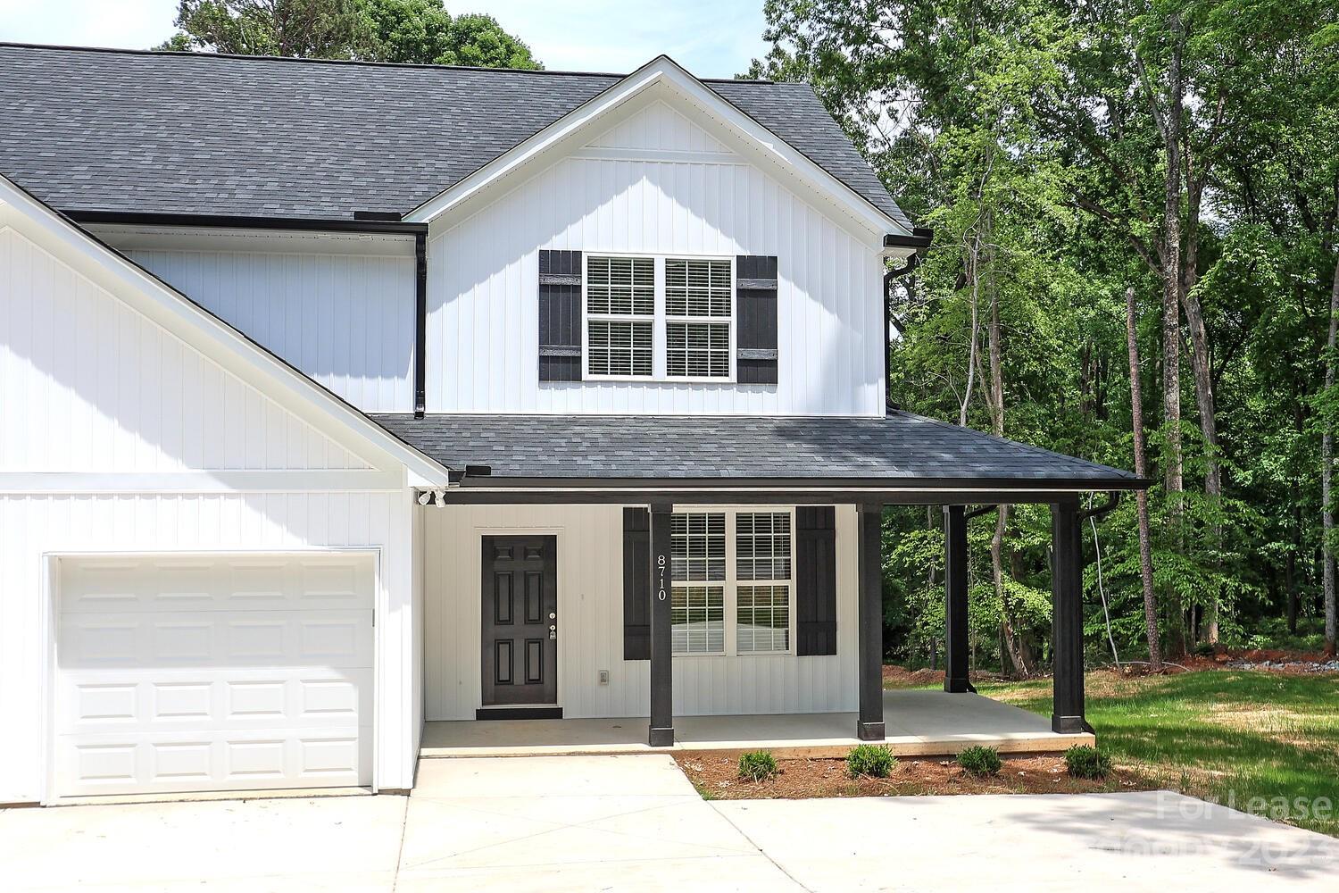 8710 Island Point Road Sherrills Ford, NC 28673 - Photo 3 of 48 a front view of a house with a porch