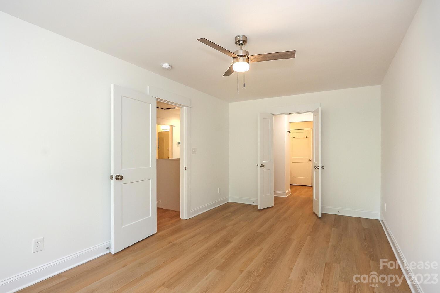 8710 Island Point Road Sherrills Ford, NC 28673 - Photo 31 of 48 a view of a room with wooden floor and white walls