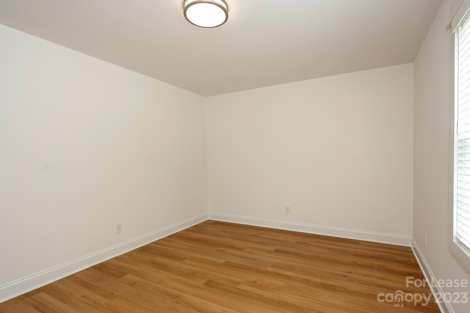 8710 Island Point Road Sherrills Ford, NC 28673 - Photo 42 of 48 a view of a room with wooden floor and white walls