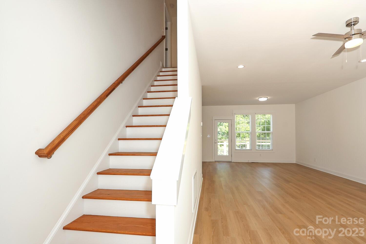 8710 Island Point Road Sherrills Ford, NC 28673 - Photo 6 of 48 a view of entryway with wooden floor and stairs
