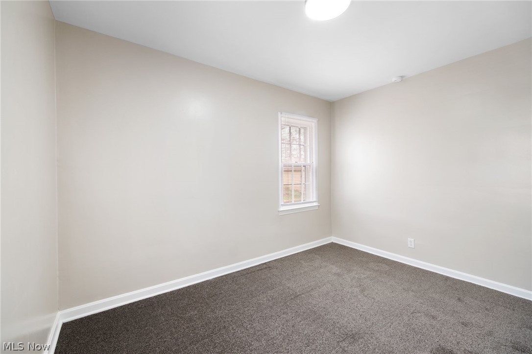 878 Reed Avenue Akron, OH 44306 - Photo 17 of 29 Spare room featuring dark colored carpet