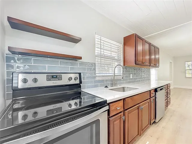 a kitchen with a stove and cabinets