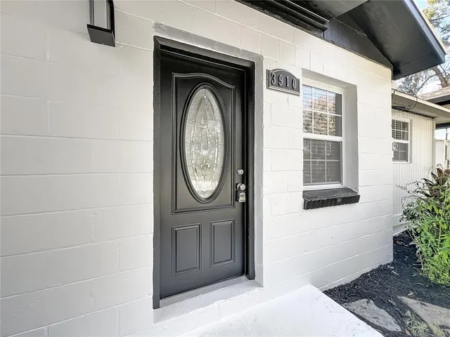a view of a door of a house with a small porch