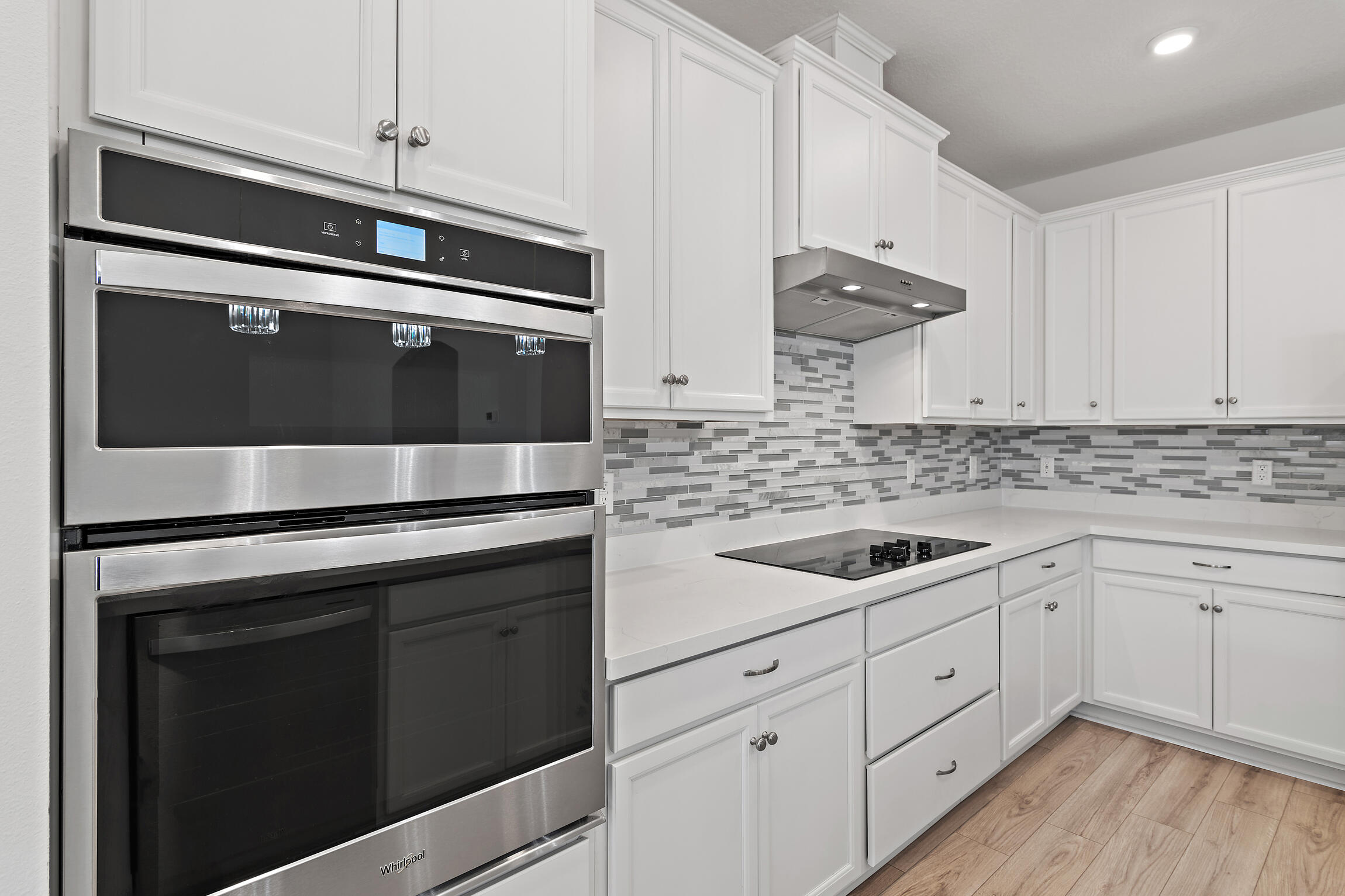 430 Fairway Crossing Freeport, FL 32439 - Photo 13 of 57 a kitchen with granite countertop cabinets stainless steel appliances and wooden floor