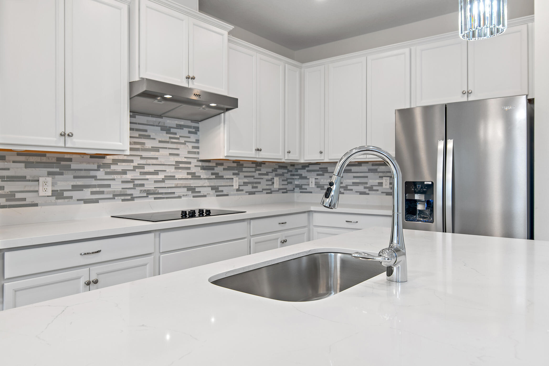 430 Fairway Crossing Freeport, FL 32439 - Photo 15 of 57 a kitchen with a sink cabinets and stainless steel appliances