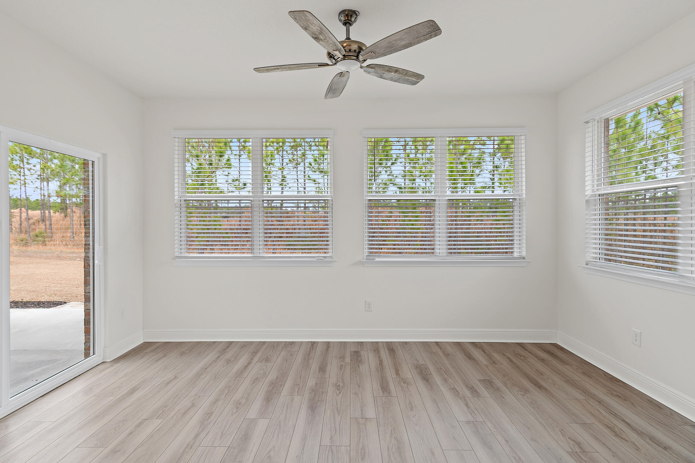 430 Fairway Crossing Freeport, FL 32439 - Photo 17 of 57 an empty room with wooden floor and windows