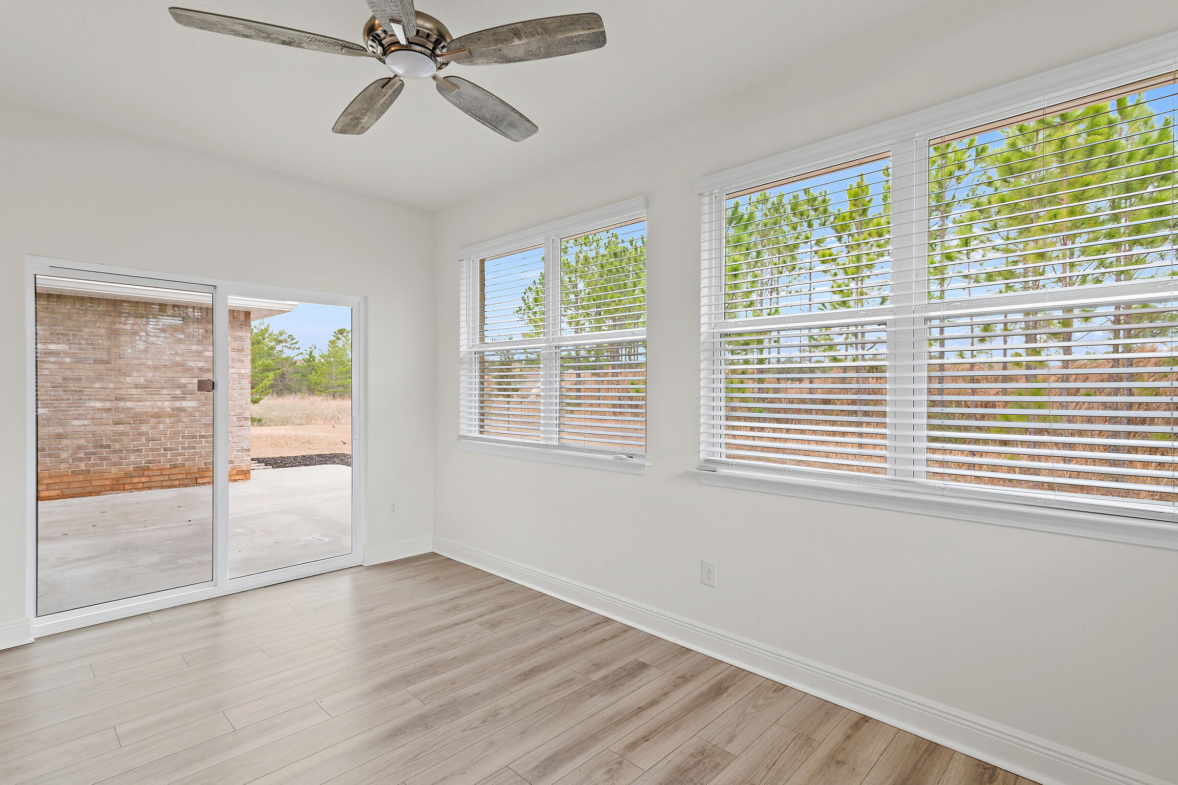430 Fairway Crossing Freeport, FL 32439 - Photo 18 of 57 a view of an empty room with wooden floor and a window