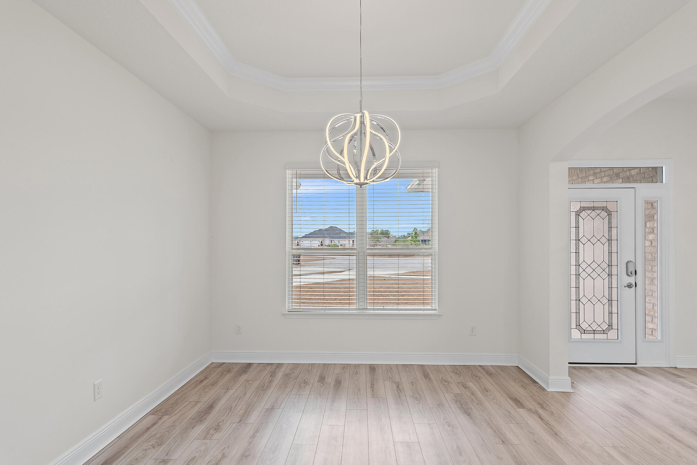 430 Fairway Crossing Freeport, FL 32439 - Photo 20 of 57 a view of an empty room with wooden floor and a window