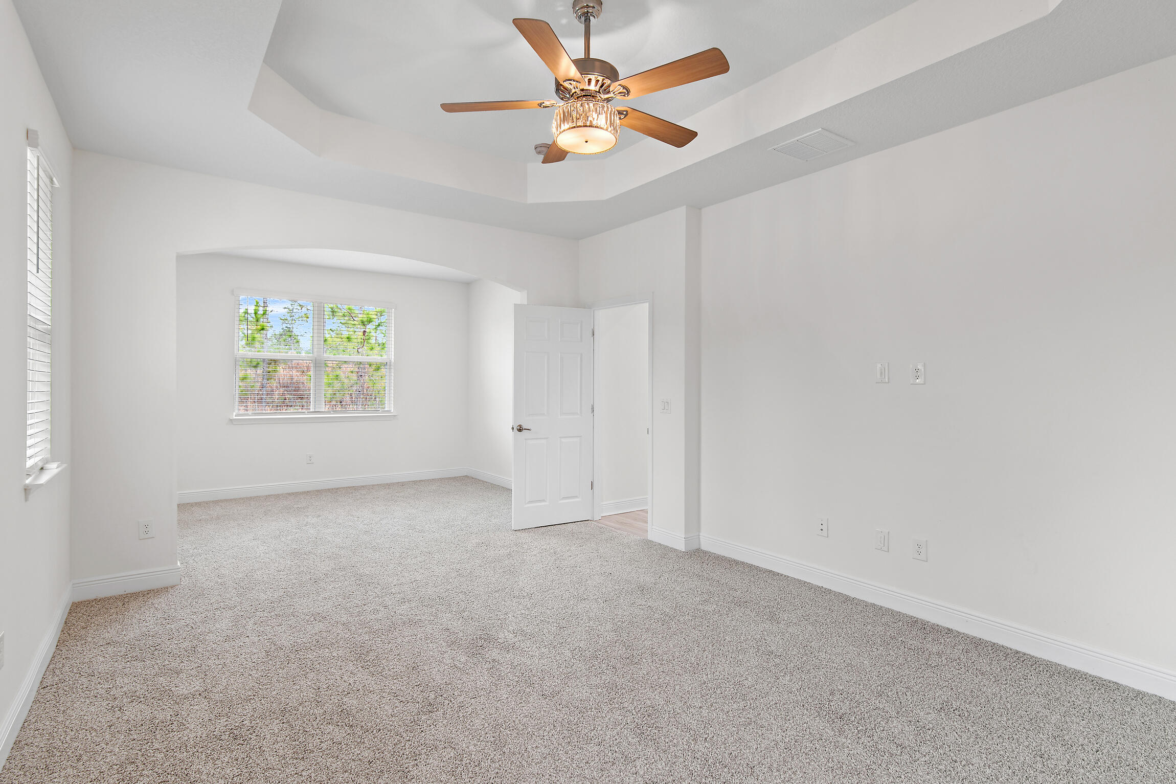 430 Fairway Crossing Freeport, FL 32439 - Photo 28 of 57 an empty room with windows and a ceiling fan