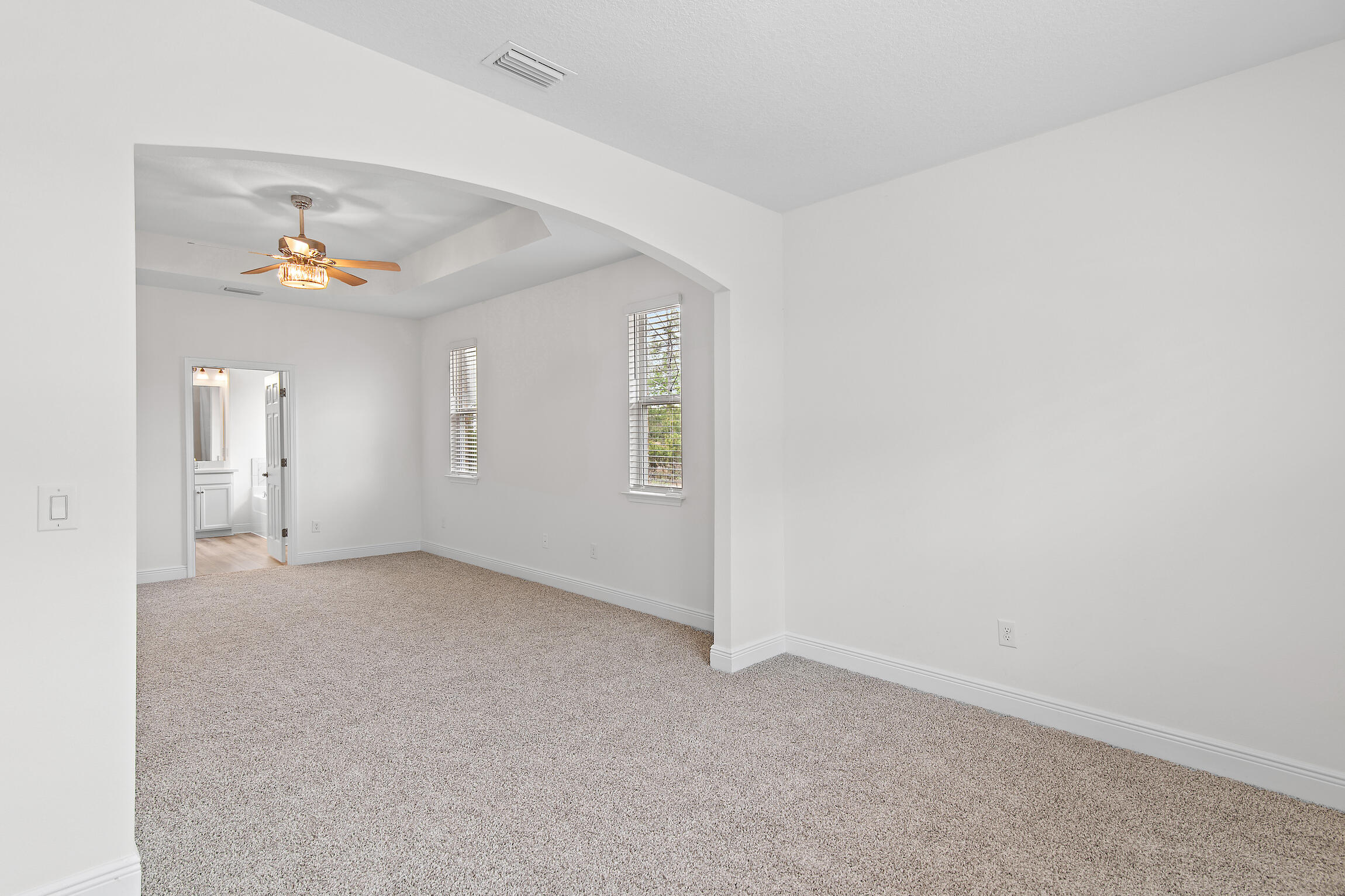 430 Fairway Crossing Freeport, FL 32439 - Photo 30 of 57 an empty room with a window and a chandelier fan