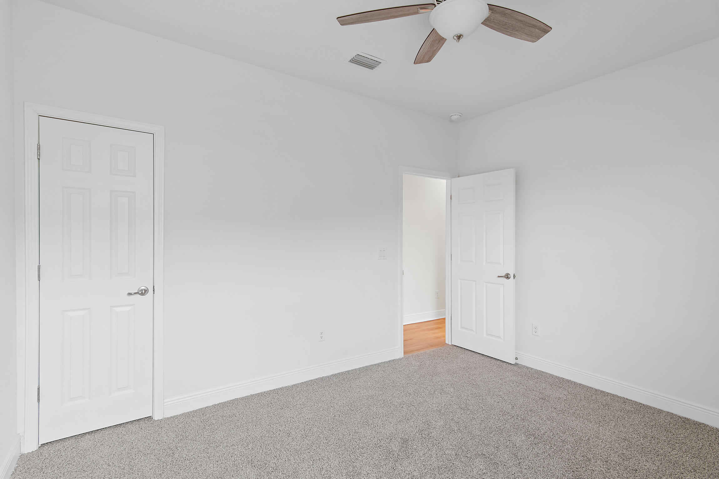 430 Fairway Crossing Freeport, FL 32439 - Photo 37 of 57 an empty room with a ceiling fan and carpet