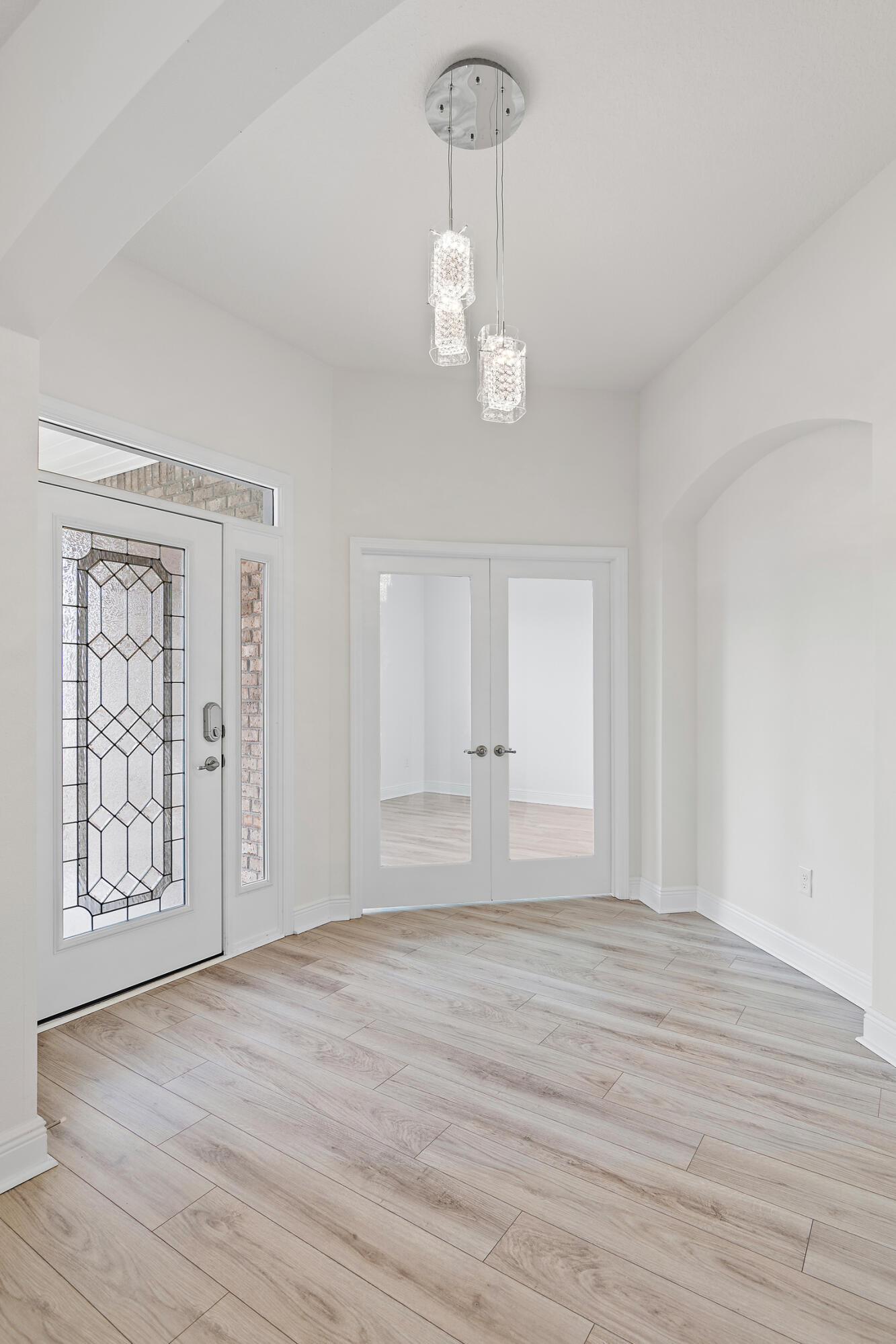 430 Fairway Crossing Freeport, FL 32439 - Photo 5 of 57 a view of an empty room with wooden floor and windows