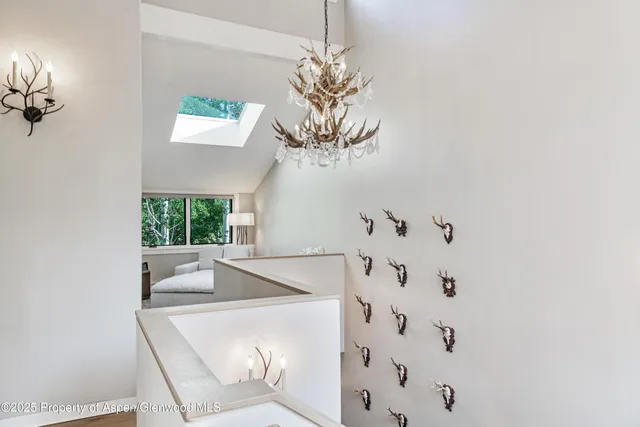 a bathroom with a bathtub sink and mirror