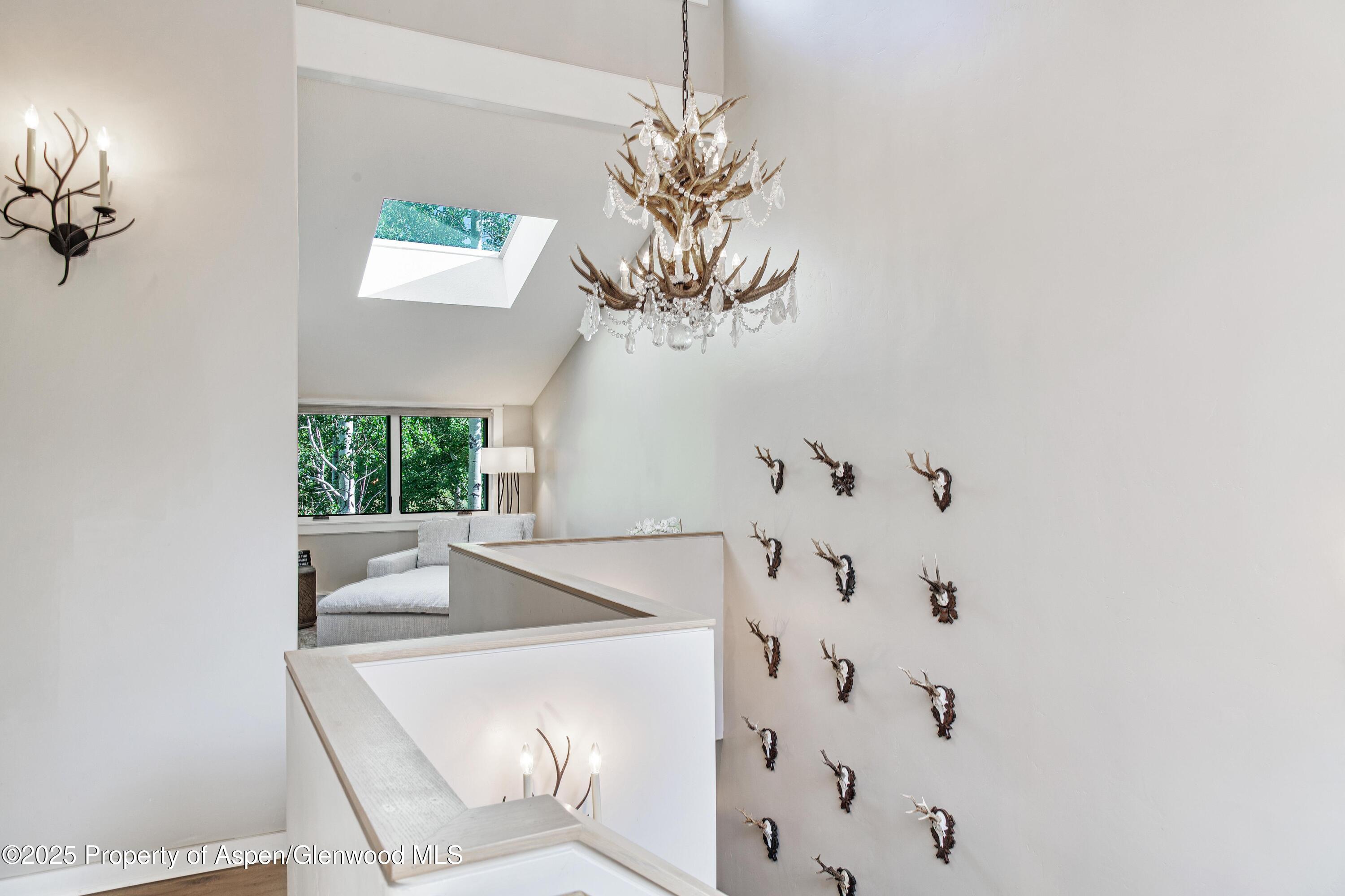 52 Harleston Green, Unit 38 Snowmass Village, CO 81615 - Photo 12 of 40 a bathroom with a bathtub sink and mirror