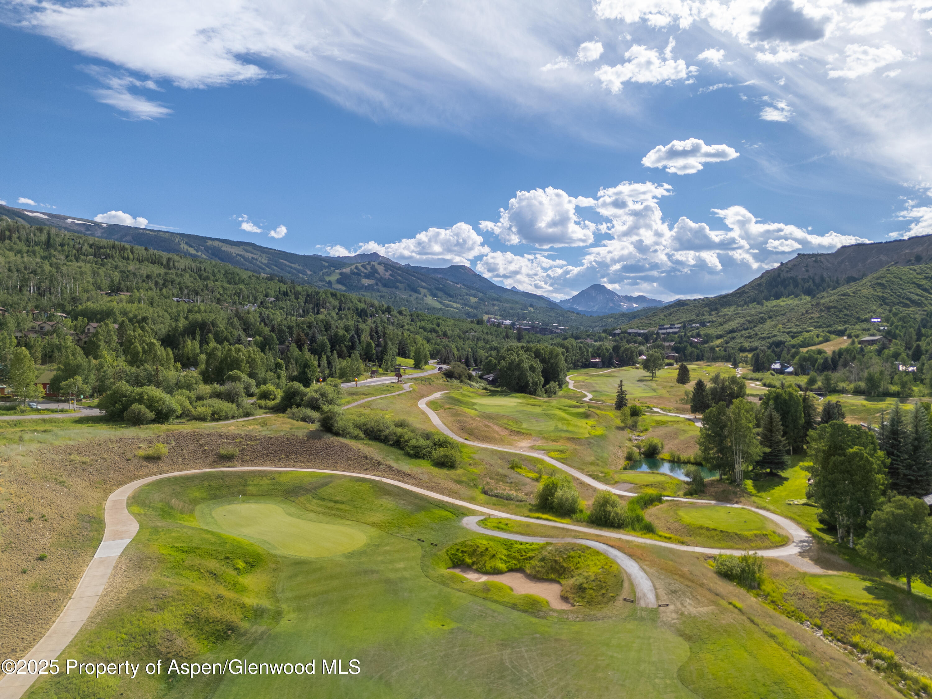 52 Harleston Green, Unit 38 Snowmass Village, CO 81615 - Photo 16 of 40 a view of a swimming pool with a mountain view