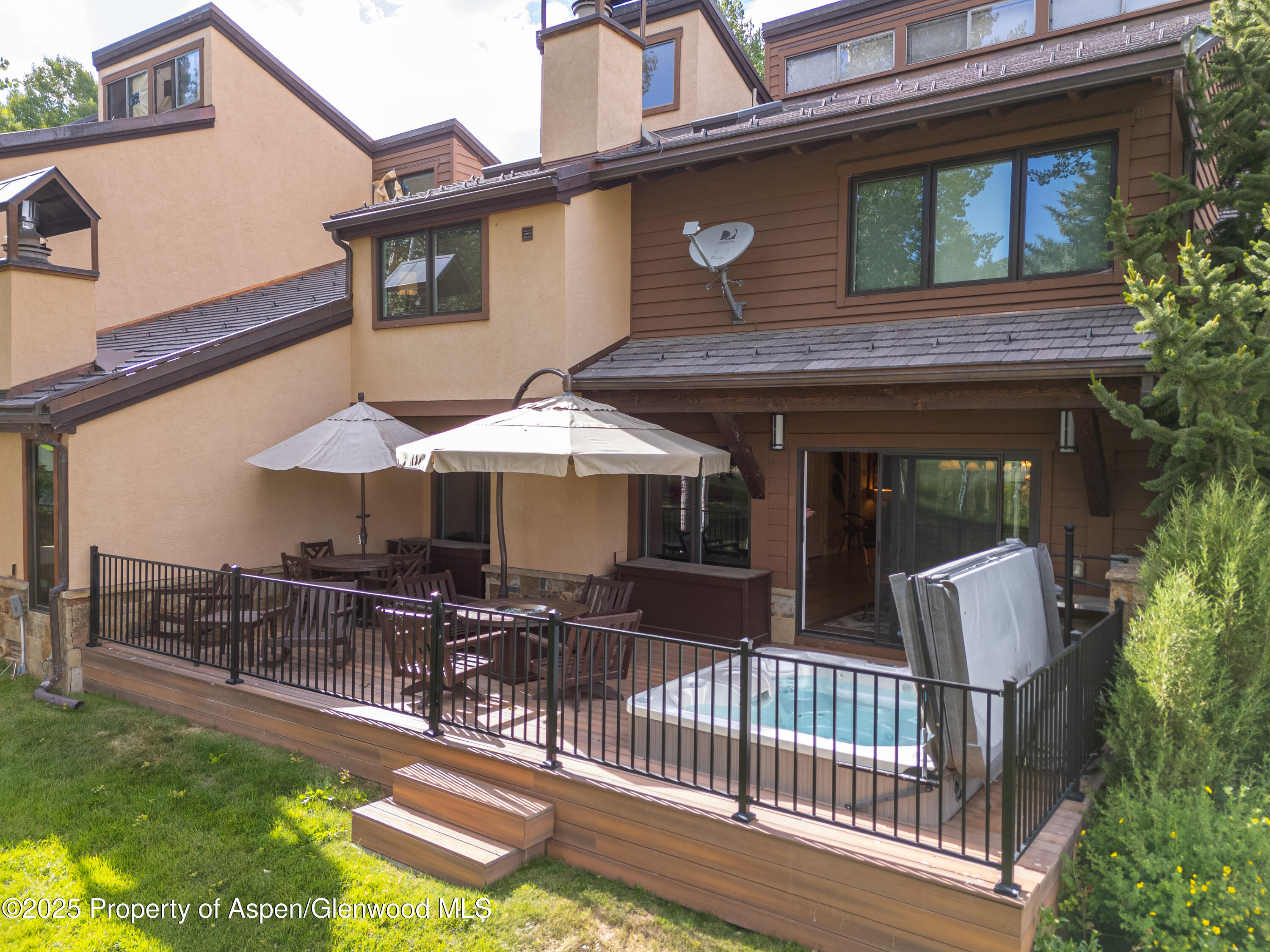 52 Harleston Green, Unit 38 Snowmass Village, CO 81615 - Photo 22 of 40 a view of house with backyard outdoor seating and hardwood floor