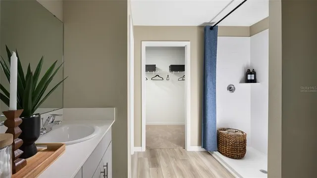 a en suite bathroom with a sink and mirror