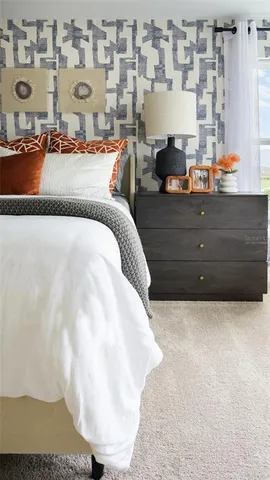 a bed room with a bed and a night stand