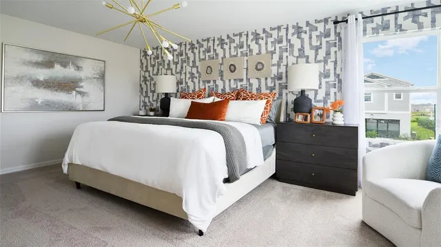 a spacious bedroom with a bed and a couch