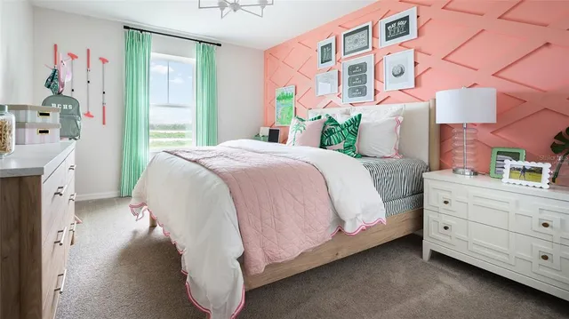 a bed room with a bed and a dresser