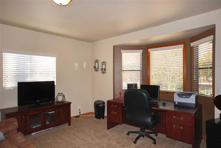 198 Riverside Road Oak View, CA 93022 - Photo 12 of 24 a view of a livingroom with workspace and a window