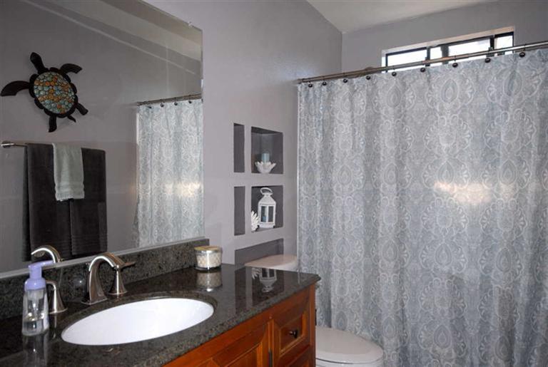 198 Riverside Road Oak View, CA 93022 - Photo 14 of 24 a bathroom with a granite countertop sink and a mirror