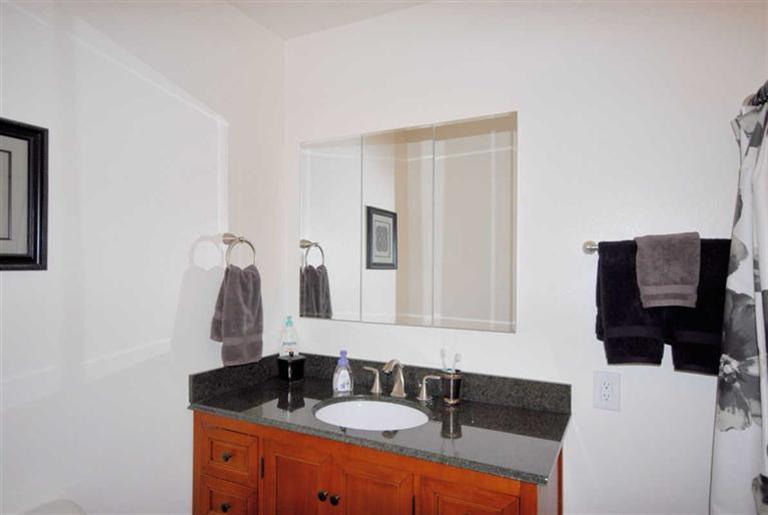 198 Riverside Road Oak View, CA 93022 - Photo 15 of 24 a bathroom with a sink and a mirror