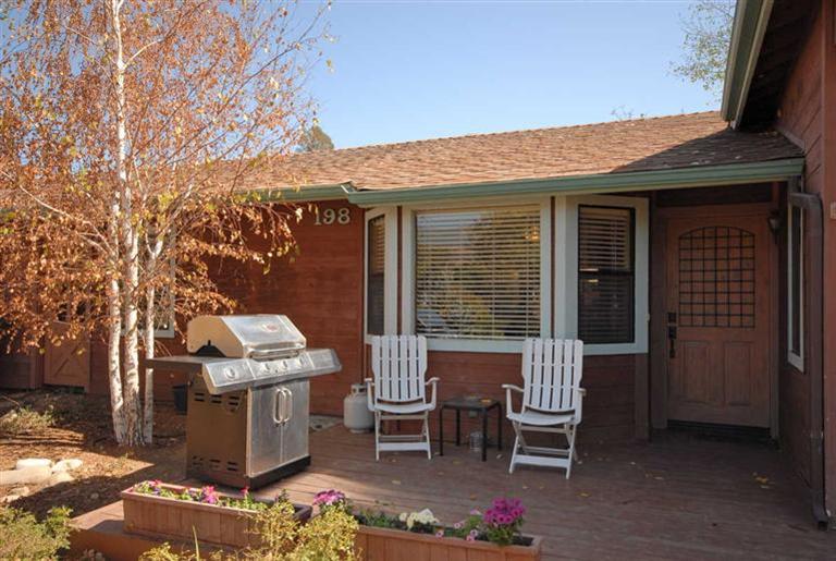 198 Riverside Road Oak View, CA 93022 - Photo 20 of 24 a view of a patio with table and chairs and potted plants