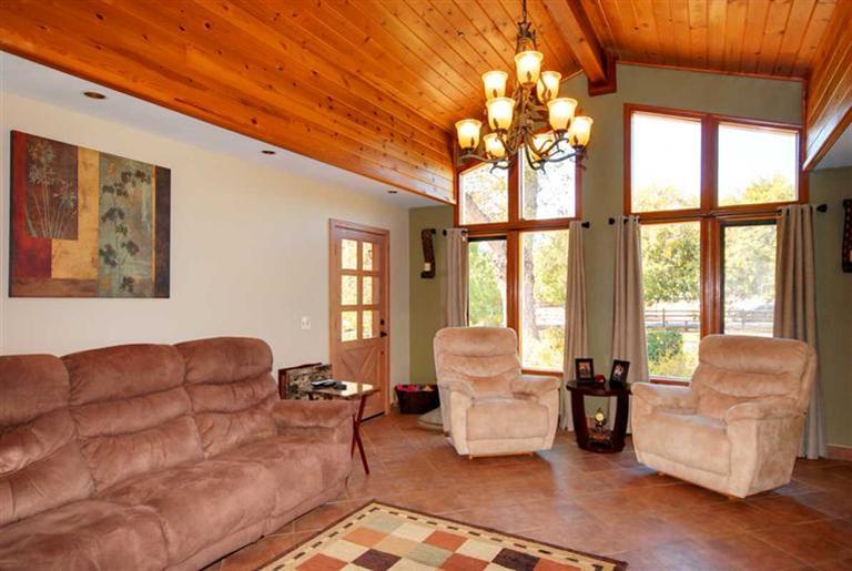 198 Riverside Road Oak View, CA 93022 - Photo 4 of 24 a living room with furniture and a large window