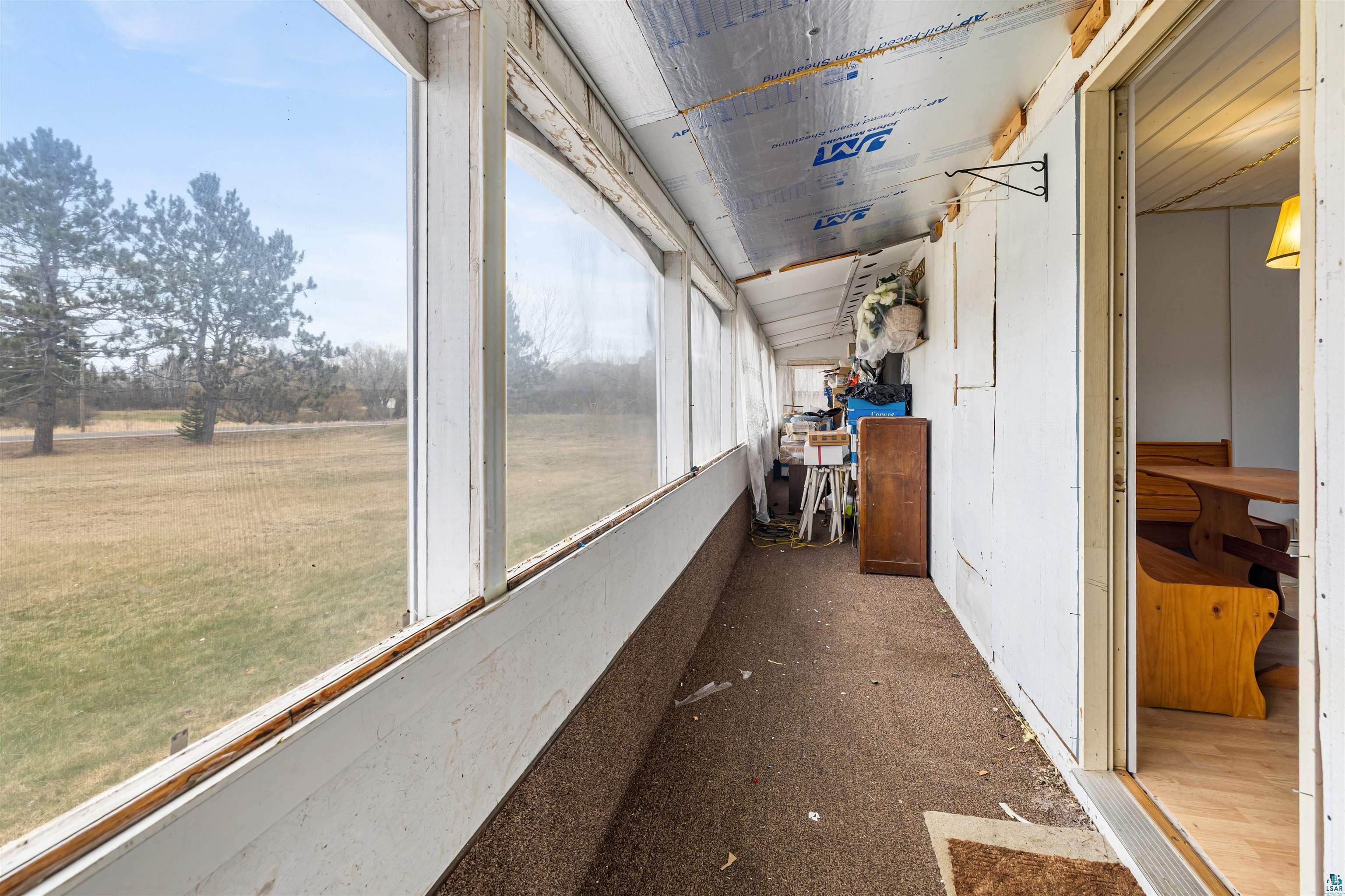 11574 Town Line Road Hibbing, MN 55746 - Photo 22 of 41 Enclosed porch with expansive window panels