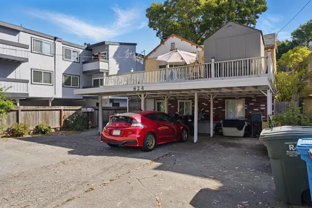 a front view of a house with parking space