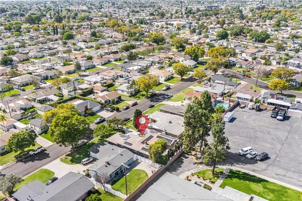 an aerial view of a houses with a yard